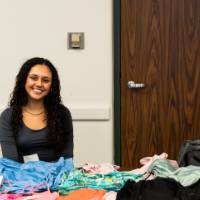 Student entrepreneur selling products at the mentor mixer